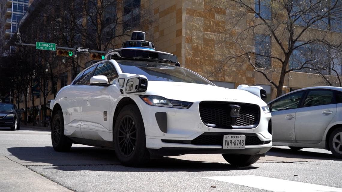 Waymo vehicles block traffic in Downtown Austin during weekend storm